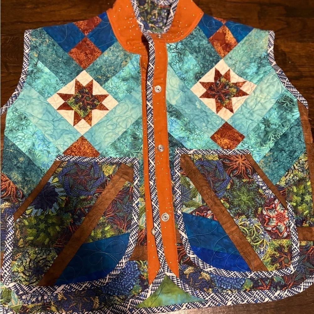 Original vest made from thrifted baby quilt. Size medium.